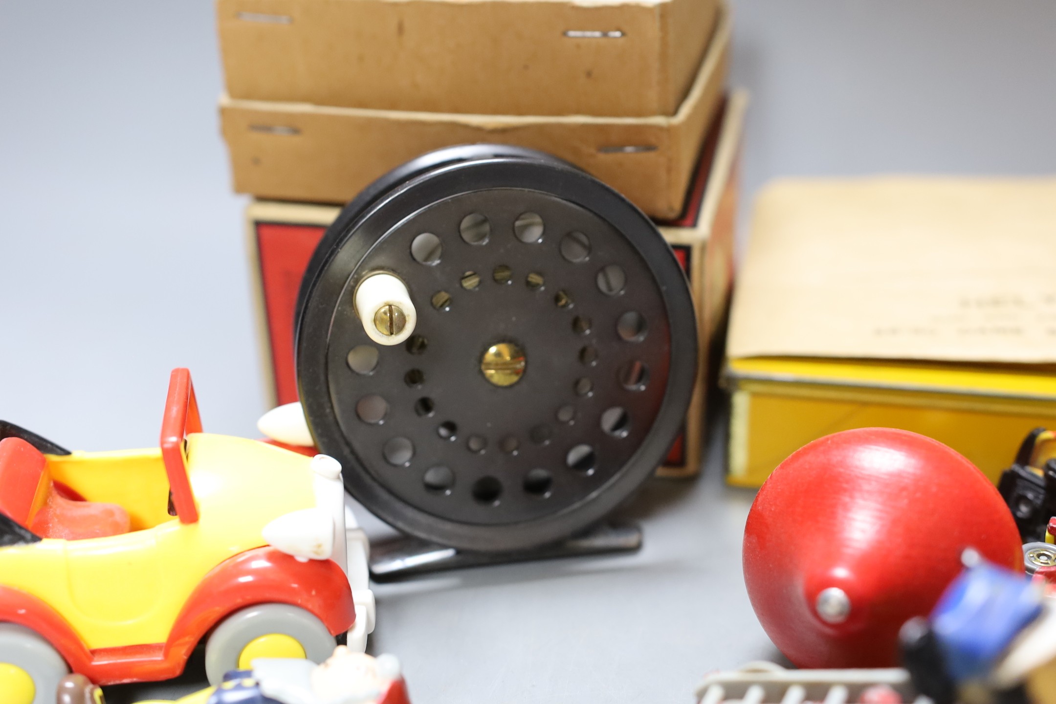 Three fishing reels, flies, lines etc., and a collection of Noddy and Mickey Mouse toys